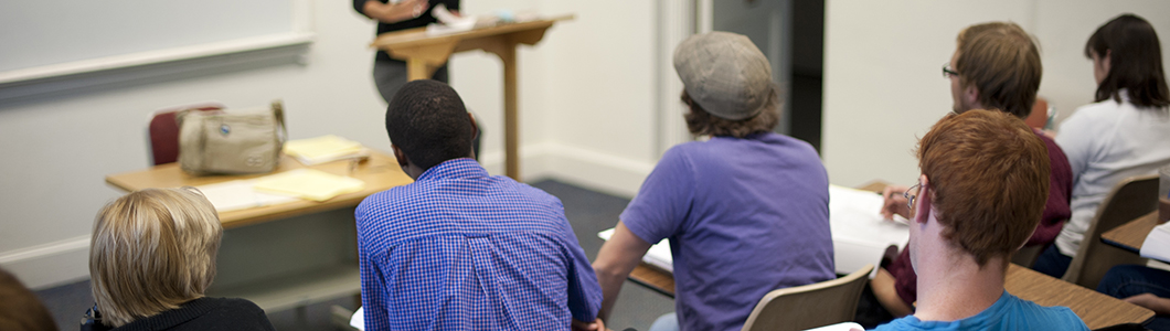 A group of students pay attention during seminar.