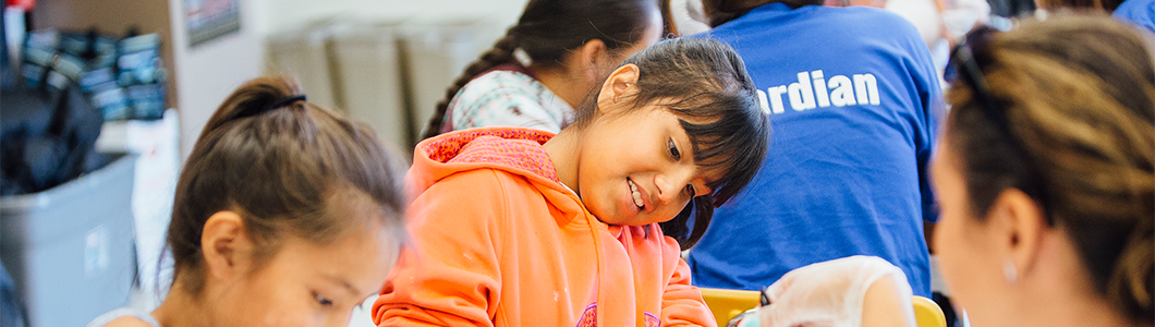 Little girl working with a group.