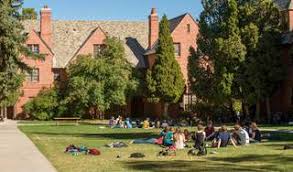 Students sitting outside quads on sunny day