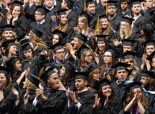 Students in caps and gowns at graduation ceremony