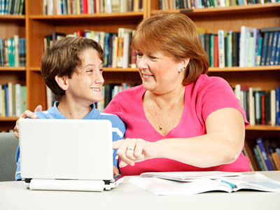 grandmother with grandson on computer