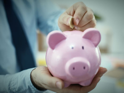 man adding money to a bank