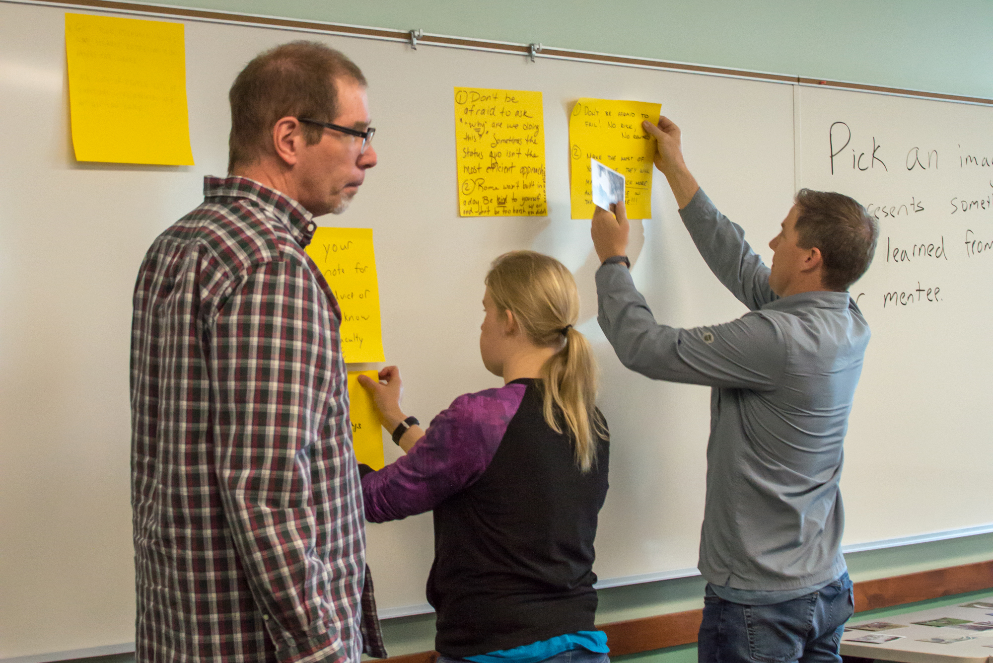 faculty at the whiteboard during a mentor session