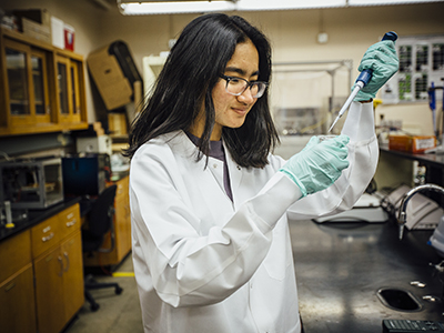 International student working in science lab