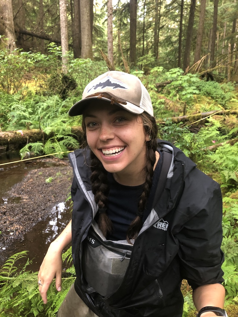 Katie Furey standing in front of a stream