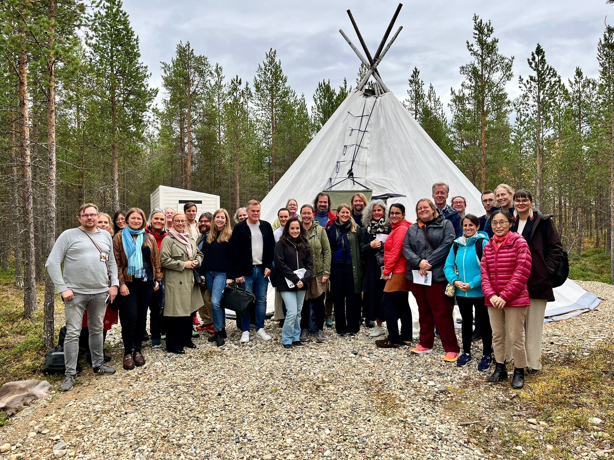 group of people with teepee