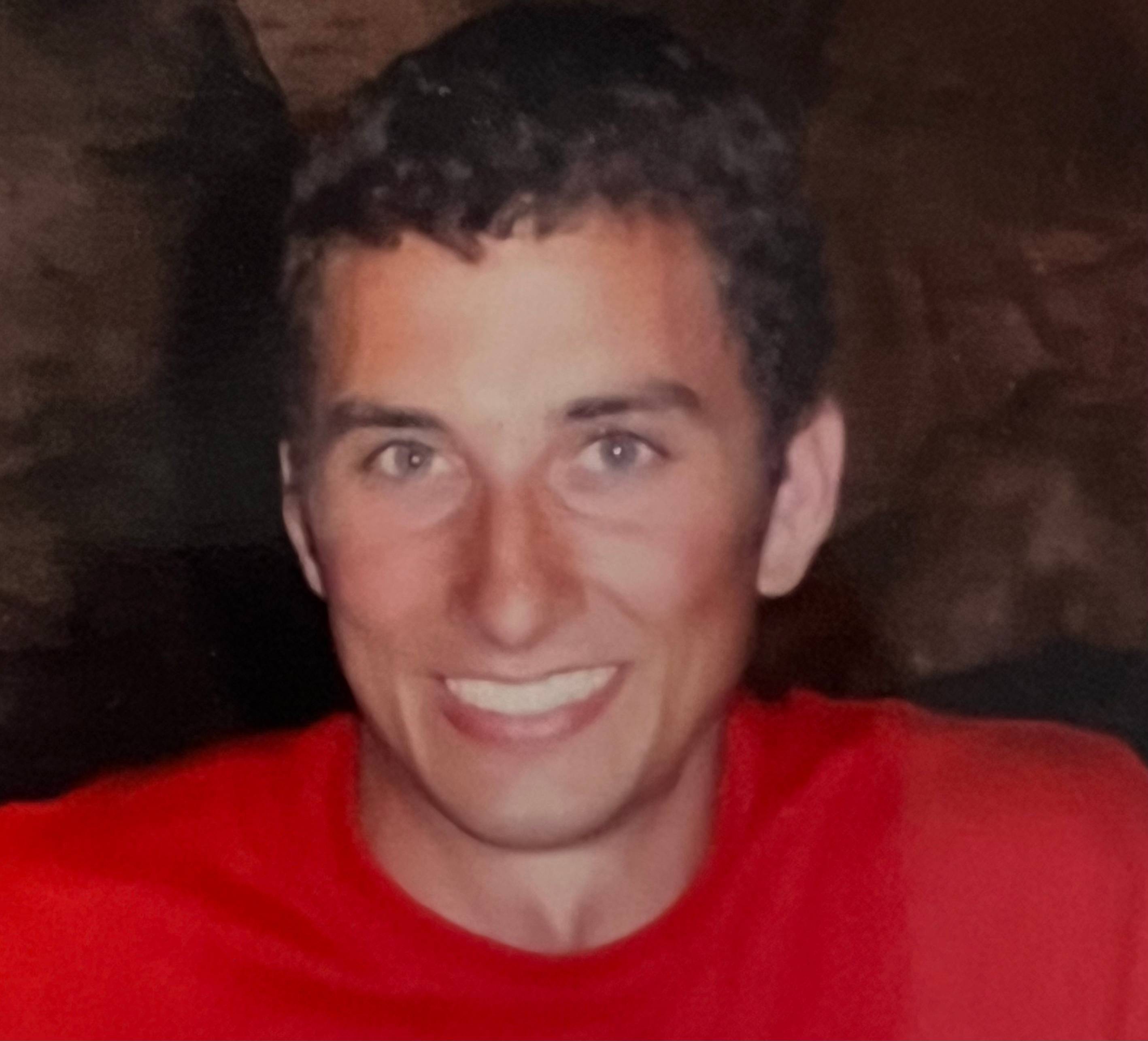 Male student wearing red shirt